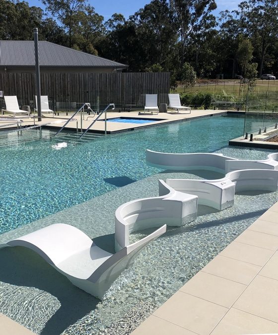 Pool with Luxury Designed Benches — Pool Builders in Warana, QLD