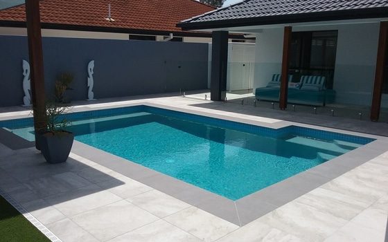 Concrete Pool with Glass Fence — Pool Builders in Warana, QLD