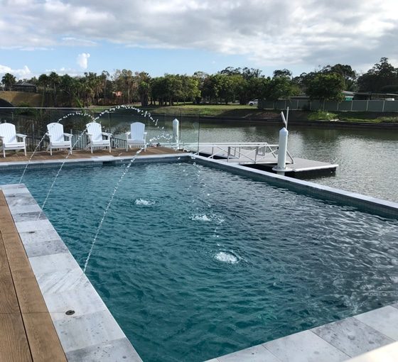 Infinity Edge Pool Beside the Lake — Pool Builders in Warana, QLD