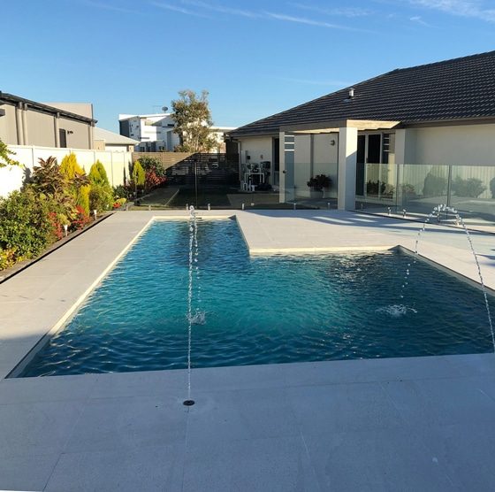 Architectural Pool with Glass Fence — Pool Builders in Warana, QLD